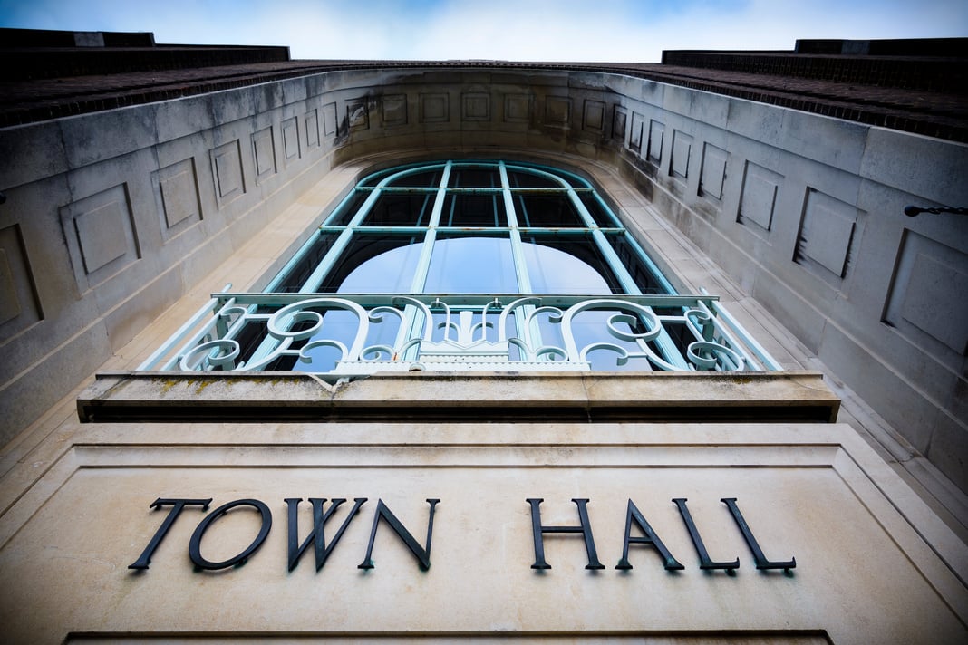 Town hall sign at local government office with balcony